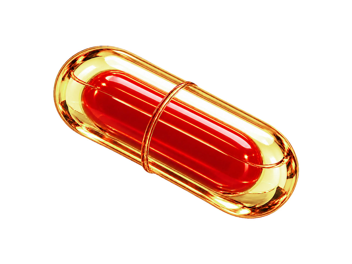 LiquiNova Co-Enzyme Q10 NovaCap capsule on white, a red inner capsule inside a golden outer shell