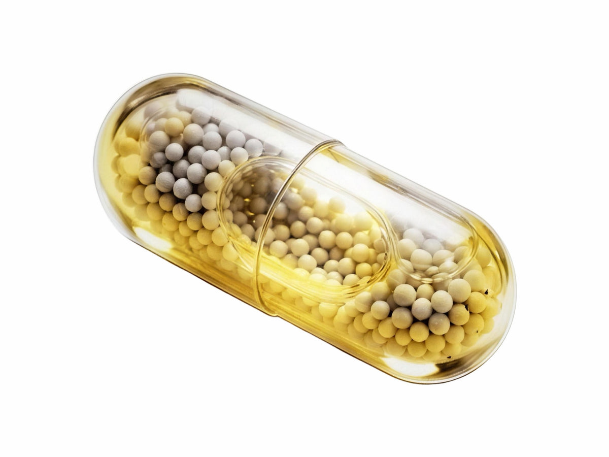 LiquiNova Multi-Vitamin Complex MicroCore capsule on white, multi-coloured beadlets
