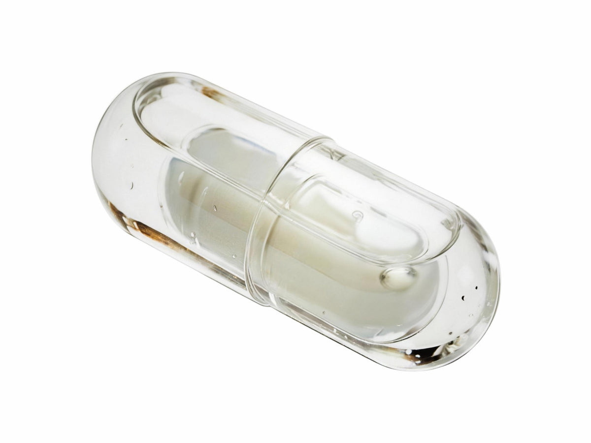 LiquiNova Probiotic 3-in-1 NovaCap dual capsule on white, one capsule inside another