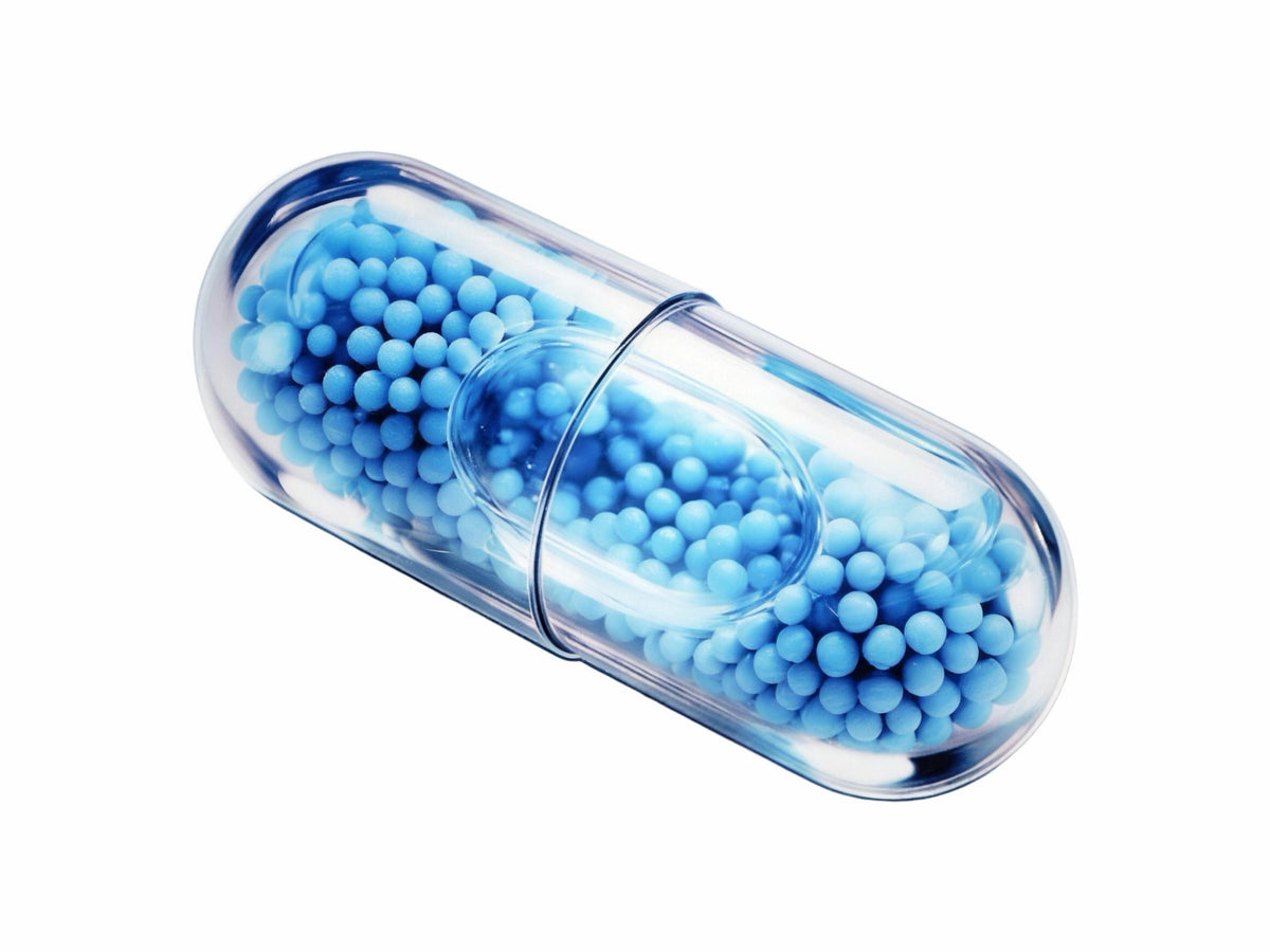 LiquiNova Sleep Well MicroCore capsule on white, blue microbeadlets in a clear shell