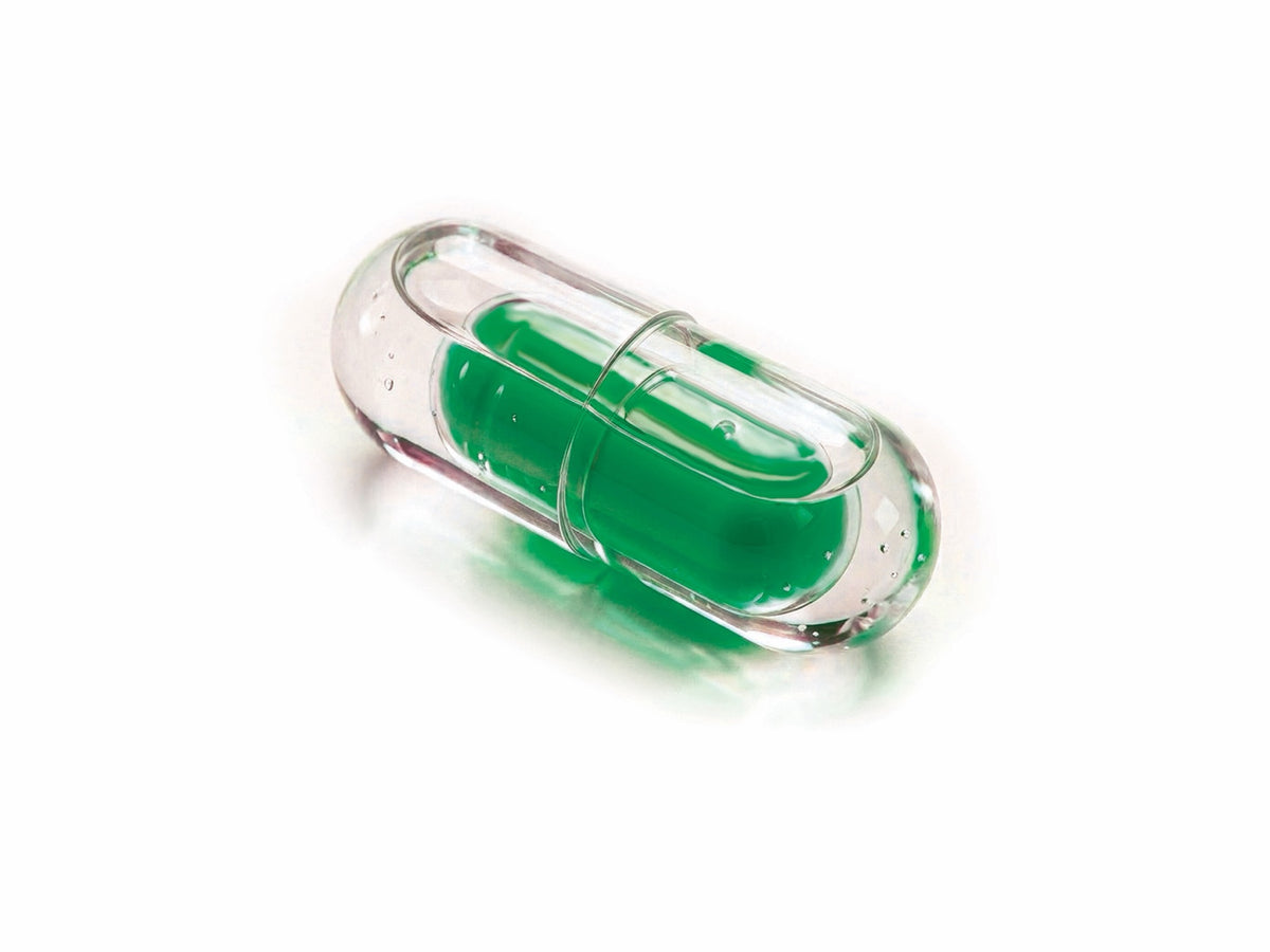LiquiNova Vitamin B-Complex NovaCap dual capsule on white, green time-release fill